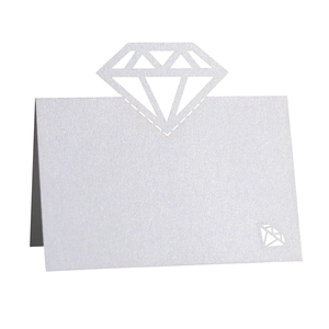 White pearlescent paper table place card with laser-cut diamond hollow design for weddings