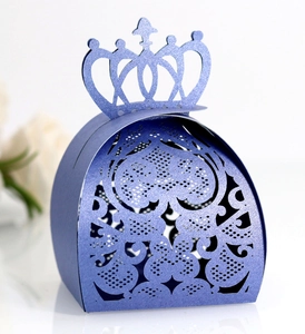 Macro shot of dark purple crown candy box featuring intricate laser-cut heart patterns