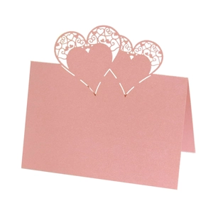 Pink pearl paper place card with laser-cut heart pattern for wedding and Valentine decor