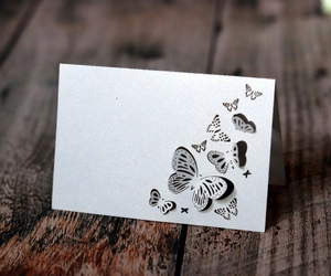 Detailed laser-cut butterfly hollow pattern on high-quality white pearlescent place card
