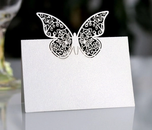 Detailed laser-cut butterfly place card in pearl white for wedding table settings