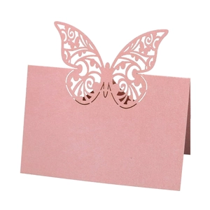 Laser-cut 3D butterfly place cards made of pink pearlescent paper for wedding table decor