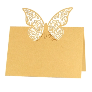 Detailed laser-cut hollow butterfly design on a gold pearlescent folding place card