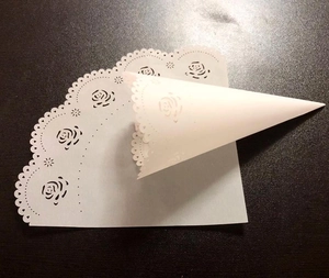 Laser cut white rose pattern paper petal cones for wedding flower petals and confetti