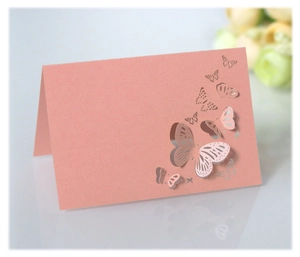 Detail of laser-cut 3D butterfly place card in pearlescent rose gold finish