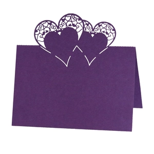 Deep purple laser cut heart place card for weddings with intricate floral patterns
