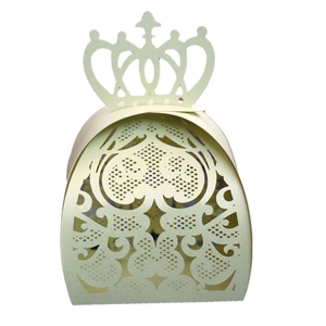 Close-up of laser-cut crown pattern on light green wedding favor candy box
