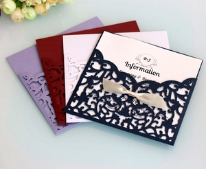 Detailed laser-cut wedding invitation pocket with silk ribbon in multiple colors