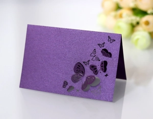 Detailed laser-cut purple glitter butterfly place card with 3D hollow design and shimmer finish