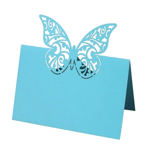 Light blue laser-cut butterfly place card for wedding table setting and guest names