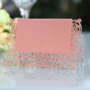 Laser-cut butterfly place card in pearlescent rose pink for elegant wedding table settings