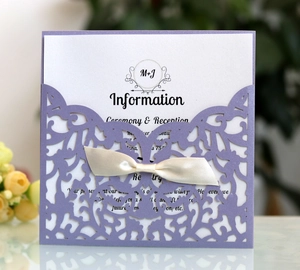 Elegant purple laser cut wedding invitation set with cream ribbon and floral lace pocket