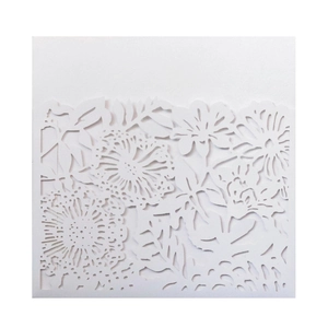 Detailed laser-cut floral pattern on elegant pearlescent white wedding invitation card