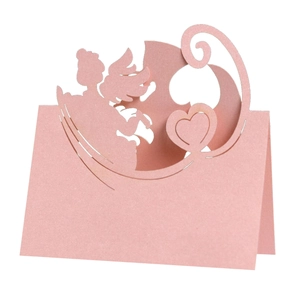 Detailed laser-cut pink place card with angel silhouette and heart on pearlescent paper