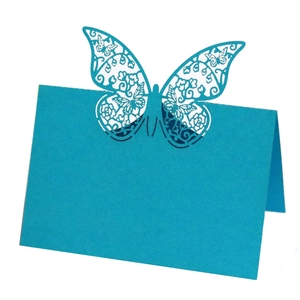 Detailed laser-cut hollow butterfly design on a peacock blue foldable place card