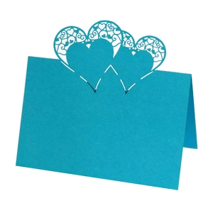 Sky blue hollow heart laser cut place card standing on white background for tables