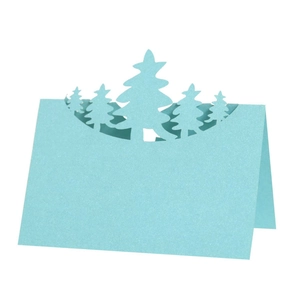 Light blue 3D hollow laser cut Christmas tree place card on a clean white background