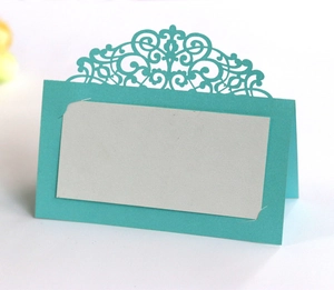 Laser cut cyan wedding place card with elegant lace pattern and white insert card