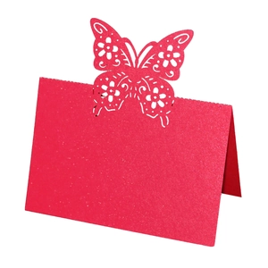 Detailed laser-cut butterfly place card in red glitter paper for wedding table decor