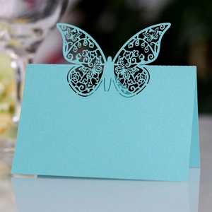 Laser cut butterfly place card in light blue with elegant pearlescent finish for weddings