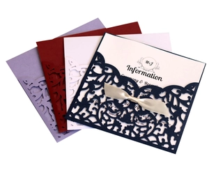 Laser cut lace wedding invitation set with silk ribbons in multiple colors