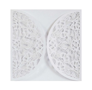 Detail showing laser cut floral mandala texture on white wedding invitation card cover