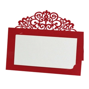 Elegant red laser-cut lace wedding place card with a white insert for names on table