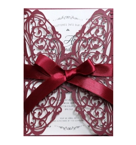 Burgundy laser-cut butterfly invitation with silk ribbon and white insert card