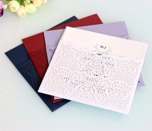 Elegant laser-cut lace wedding invitations in navy, burgundy, mauve, and white colors