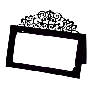 Elegant black laser cut wedding place card with intricate lace pattern and white insert