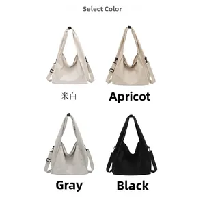 Selection of large canvas hobo bags in off-white, apricot, grey, and black colors