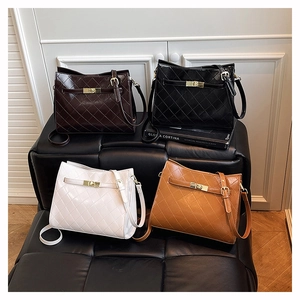 Collection of quilted leather crossbody bags in four colors with gold metal buckles