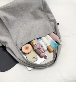 Interior view of grey minimalist tote bag showing spacious capacity for daily items