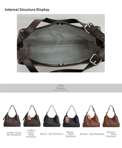 Detailed interior view of a spacious underarm bag showing magnetic clasp and grey lining