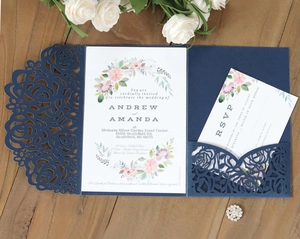 Detailed laser cut rose pattern on navy blue wedding invitation suite with RSVP card