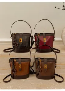 Detail view of retro bucket bags in four vintage colors with metallic twist locks