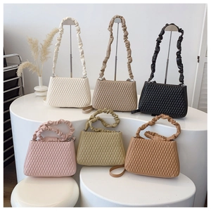 Detailed display of quilted crossbody bags in six colors with pleated shoulder straps