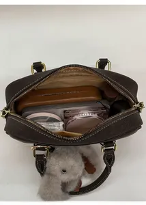 Top view of brown bowling bag interior showing large capacity and internal zipper pocket
