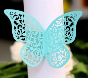 Detailed laser-cut light blue butterfly napkin ring with intricate vine patterns
