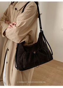 Close-up of minimalist retro tote bag with drawstring pocket and matte texture finish