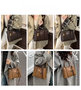 Lifestyle view of a brown bucket bag with lychee texture and ethnic bead charm