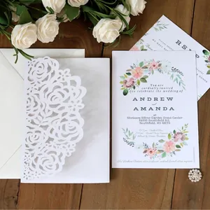 Laser cut white rose wedding invitation suite with floral inner card and envelope