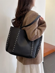 Vintage black leather tote bag with silver rivets and large capacity for women commuting
