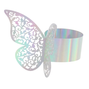Macro detail of laser-cut butterfly napkin ring with iridescent holographic finish