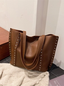 Brown lychee grain leather tote bag with silver studs for daily commute and fashion