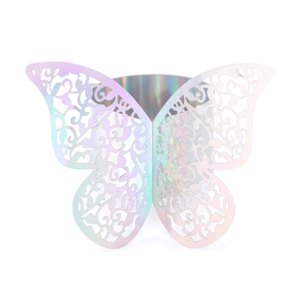 Detailed macro view of holographic laser-cut butterfly napkin ring with floral patterns
