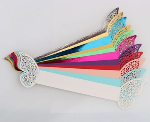 Laser-cut butterfly napkin rings in various metallic colors for wedding and party decor