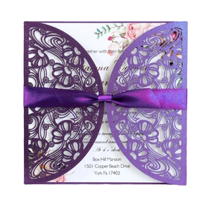Elegant purple laser-cut wedding invitation card with silk bow and floral interior