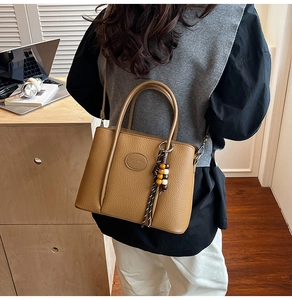 Caramel lychee pattern bucket bag with bead tassel charm and detachable shoulder strap