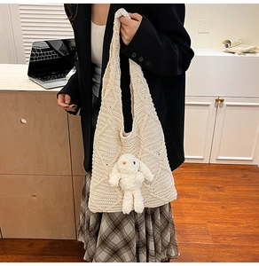 Detailed knit tote bag with 3D diamond texture and cute plush rabbit charm accessory